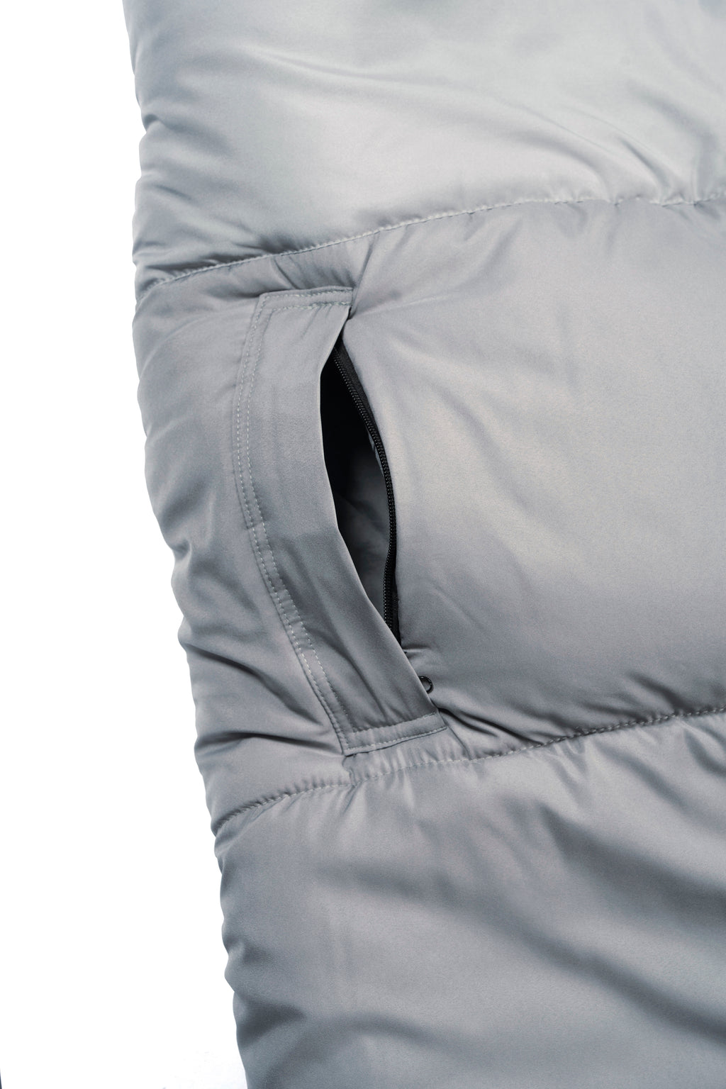 Close-up of a grey wearable SnoozePod's arm opening with zipper