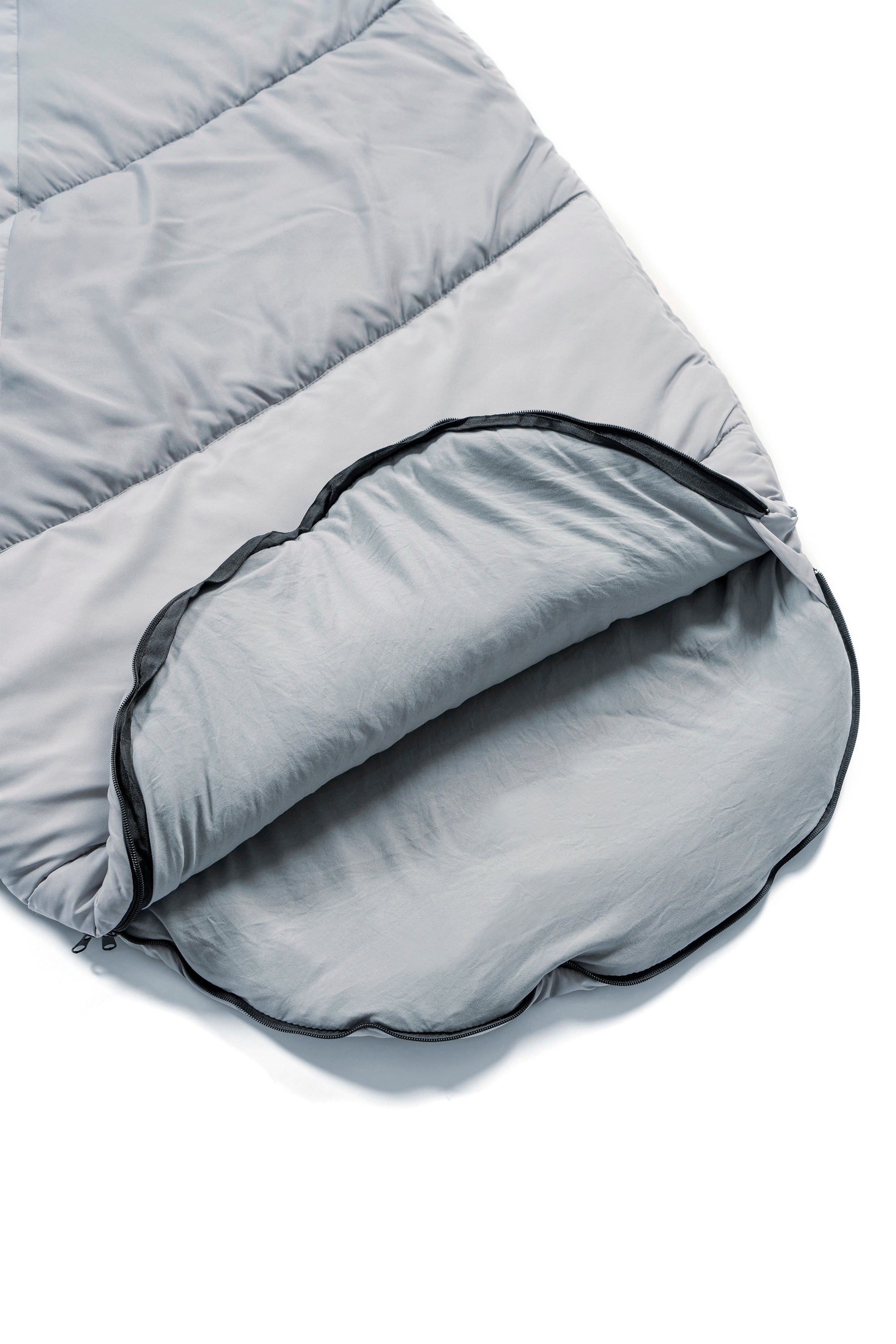 The foot zipper opening of a a wearable sleeping bag, the SnoozePod – this one in two tone grey