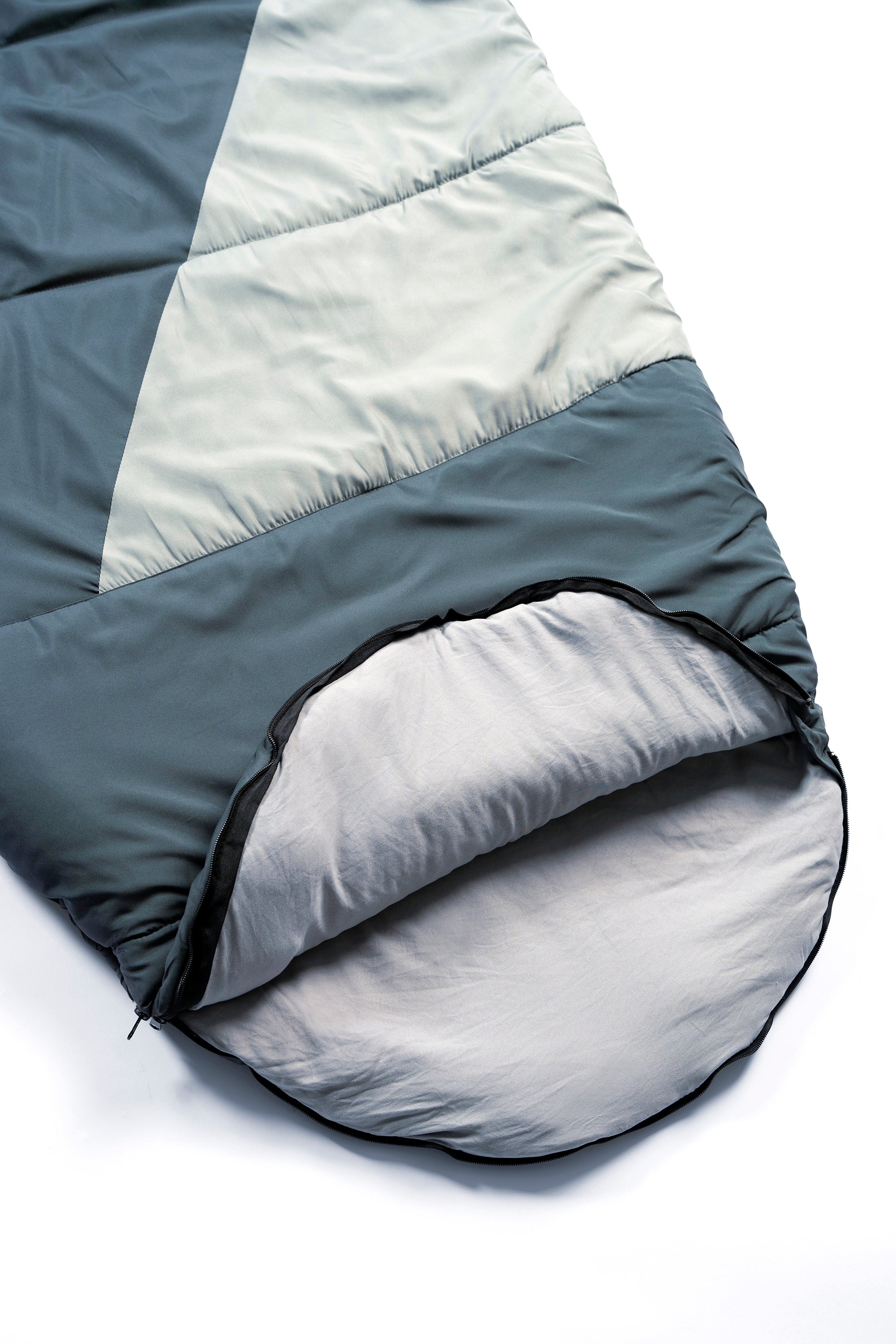 The foot zipper opening of a a wearable sleeping bag, the SnoozePod – this one in two tone green, or teal