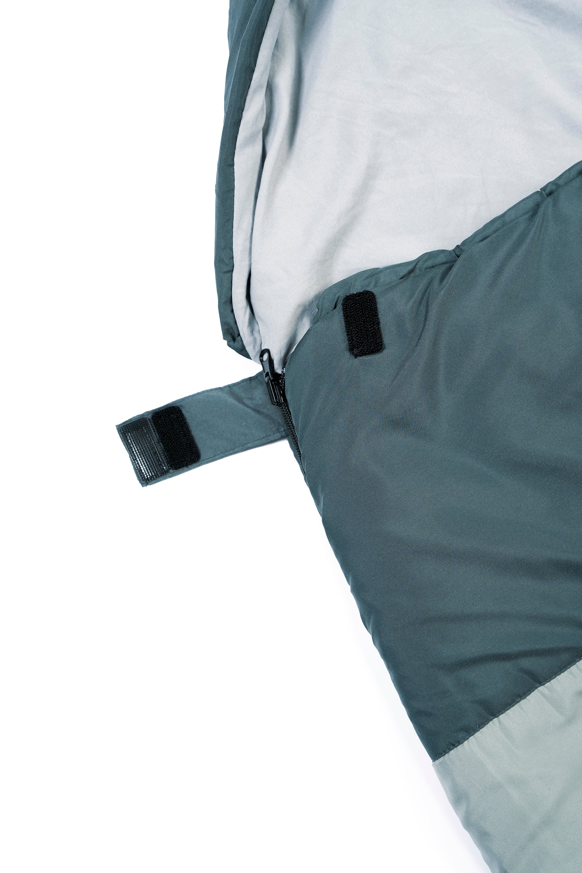 Close-up of a green wearable sleeping bag's side zipper and fastener
